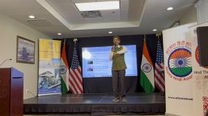 Hiten Bhuta speaking on stage during Hindi Divas program in Atlanta
