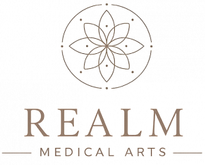 The official logo for Realm Medical Arts in Provo, featuring a minimalist brown geometric floral design above the company name.