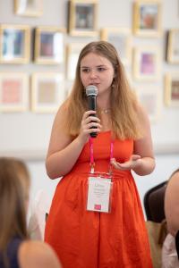 Sweet Briar student Chloe Burchett ’26 speaks at an alumnae leadership event, demonstrating the confidence and leadership skills the new Center for Business, Entrepreneurship & Innovation will help students develop.