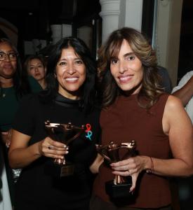 More than 230 guests gathered at The Highlawn to celebrate culture, honor service, and show that everyone belongs at the table Assemblywoman Alixon Collazos-Gill, left, and Senate Majority Leader M. Teresa Ruiz hold their Unity Table awards at Todos a la Mesa.