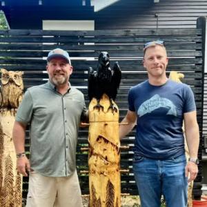 Author Aaron Chavez and Commander Erik Dippold with Ari