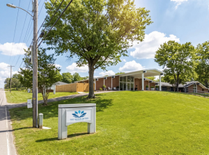 Outdoor shoot of treatment center building with sign that reads The Haven Detox Tennessee