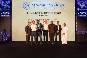 Group photograph on stage at the AI World Series Awards 2026 in Dubai, with the AI Solution of the Year winner announcement displayed behind them.