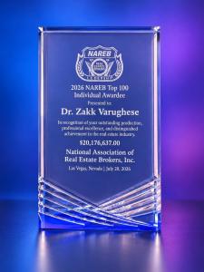 Crystal 2026 NAREB Top 100 Individual Awardee plaque engraved with the name Dr. Zakk Varughese