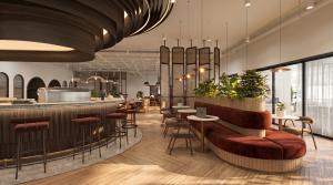 Premium Common Ground workspace interior featuring a curved café counter, burgundy lounge seating, rattan partitions and warm wood finishes at The Capitol, Petaling Jaya.