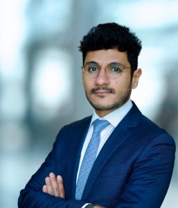 Portrait of Roger Attieh, Executive Education Client Director at London Business School, in a navy suit with arms crossed