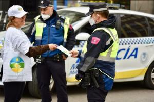 Scientology volunteers distributing happiness to Police in Madrid