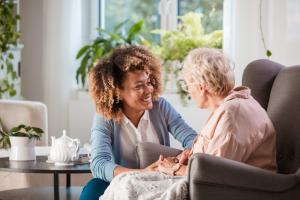 Home care worker and senior woman interacting