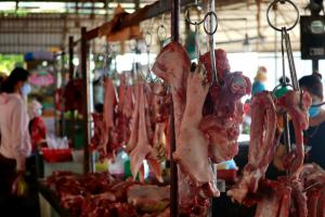 "Wet Market" is a live animal market, local slaughterhouse. Animals sit in cages alive awaiting their turn for purchase and slaughter.
