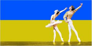 Ballet dancers Alina Cojocaru and Ivan Putrov in front of Ukrainian flag.