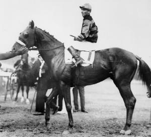 Sir Barton, ridden by jockey Johnny Loftus, won the Kentucky Derby, the Preakness Stakes and the Belmont Stakes in 1919 (photo credit: Wikipedia)