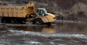 Truck driving through water at Lordstown Landfill