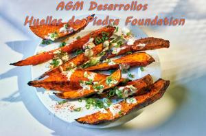 Chef-quality sliced baked glazed Yams on a round plate with sprinkles of parsley