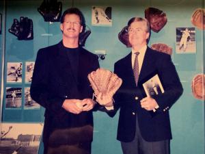 Greg A. Harris with Jeff Idelson, retired President of The Baseball Hall of Fame presenting his six finger glove.