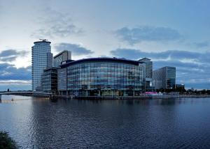 Media City, Salford in Greater Manchester seen from across the water
