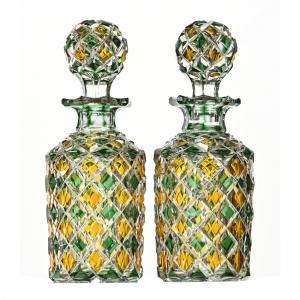 Pair of Brilliant Period Cut Glass cologne bottles, green and yellow cut to clear, having a diamond cut design with alternating colored diamonds, both 8 ¼ inches tall.