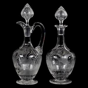 Pair of ABCG decanters signed Sinclaire with an engraved game bird décor (both feature a sandpiper and duck in flight), with pattern engraved stoppers.