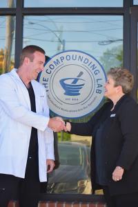 Denise Sibley, MD shaking hands with Josh Harrison, DPh