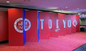 A lenticular wall display highlighting the U.S. Olympic team in Tokyo and the U.S. Paralympic team in Beijing.
