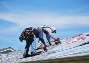 roofers working on a roof installation in RI