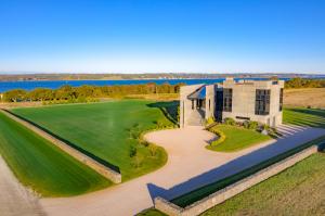 Built to entertain, the stately grand pavilion entrance with custom cast entry steps and manicured two-acre parcel will impress from first sight.