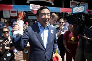 Andrew Yang eating a turkey leg at the 2019 Iowa State Fair in Des Moines, Iowa. By Gage Skidmore. Source: Wikimedia Commons