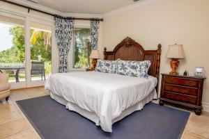 Master suite with marble vanity and whirlpool spa