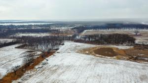 The garden adage “right plant, right place” may be the latest tool in the toolbox for conservation ecologists and land restoration specialists working to help plant communities adapt to climate change alt="Aerial view with snow of 180-acre research project area at Grant Woods in Ingleside, Ill."