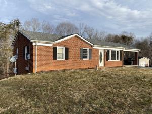 3 bedroom 2 bath brick ranch home measures 1,968± sf. (984± finished sf. main level and 984± finished sf. basement) and features a kitchen/dining area (conveying appliances); living room; finished walk-out basement; attic w/pull down stairs; and attached brick carport
