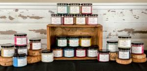 Rustic Charm is famous for its 12 ounce soy candles and their large scent throw. They have a classic product line of 25 scents and sell candles, wax melts, room sprays, reed diffusers, and car scents.