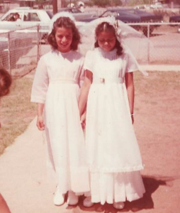Clients Diana Alamader-Douglas and "Jane Doe" at their first communion outside of St. Bernard Catholic Church in Pirtleville, AZ.