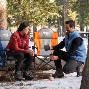 Couple enjoying the gobi heat heated camping chair