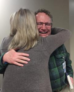 Lori Dultmeier giving a hug to the surgeon who tried to save her daughter 19 years ago