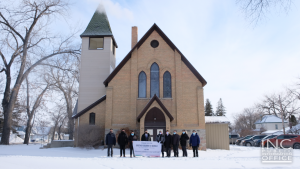 <img src="image10.png" alt="Group photo of Ministers and members of Iglesia Ni Cristo outside newly purchased chapel in Neepawa, Manitoba, Canada" />