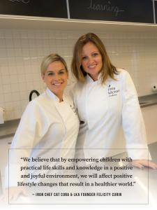 Iron Chef Cat Cora with Little Kitchen Academy founder standing together in a Little Kitchen Academy with the quote "We believe that by empowering children with practical life skills and knowledge in a positive and joyful environment, we will affect posit