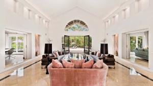 A sweeping drive leads to the front porch and spectacular double-height grand entry beyond it, setting a welcoming and impressive tone.
