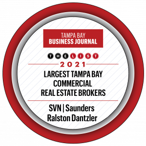 A graphic badge of the TBBJ Top CRE Brokerages 2021 award winner