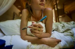 Van life woman holding JoGo.