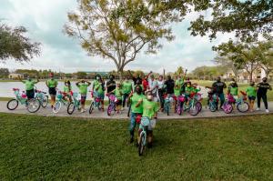 Embrace Girls Foundation members enjoy new bicycles with supporter and Interior Designer Steven G.