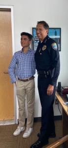 May 24, 2022 Ryan Ebrahimi meets Santa Monica Police Chief Batista, in backgound Ryan's painting hangs in the Chief's office. #colorsbyryan #policechiefbatista #santamonicapolice