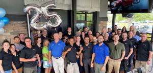 A picture of the entire Data-Tech team celebrating 25 years of business at Tampa Joe's