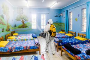 Scientology Volunteer Ministers help protect children in orphanages and children's homes by sanitizing the facilities.