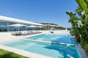 An ultramodern work of art awaits in Villa La Cinq, a unique eight-bedroom luxury oasis in Ibiza’s prestigious Cap Martinet.
