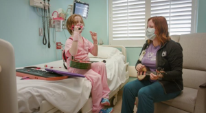 Music Therapist Kelli McKee works with Charlotte Bishop at Cardinal Glennon Children's Hospital in St. Louis, MO
