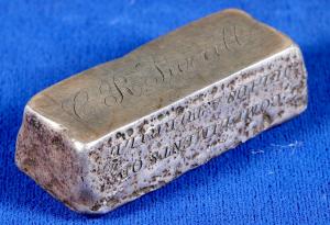 Silver ingot weighing 5.15 troy oz., engraved from Julius A. Turrill (White River / Pioche, Nev.), who owned stock in Comstock mines ($5,875).