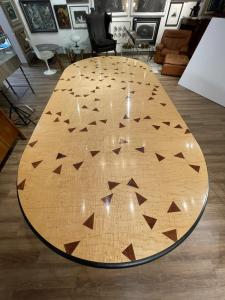 An important and beautiful dining table custom designed by Wendell Castle (American, 1932-2018) soared to $70,110, and vibrant still-life oil paintings by Lê Phổ (Vietnamese/French, 1907-2001) and Claude Venard (French, 1913-1999) sold for $20,910 and $15,990, respectively, in Neue Auctions’ online-only Modernism auction held on May 15th Dining table designed by Wendell Castle (American, 1932-2018), inlaid with purpleheart triangles and inlaid dots spelling "The Check's in the Mail” ($70,110).