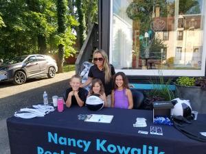 Trish Applegate from Nancy Kowalik Real Estate Group and her family were signing up contest entries.
