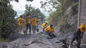 Scientology Volunteer Ministers Disaster Response Team and local volunteers, hard at work cleaning out the drains of Chateaubelair Hospital.