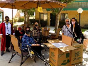 Some of the volunteers who delivered the lunches to 93 seniors living at a nearby apartment complex