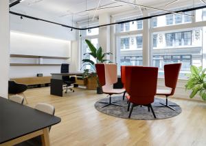 Office furniture, lounge seating, sit-stand desks, executive chair in an office